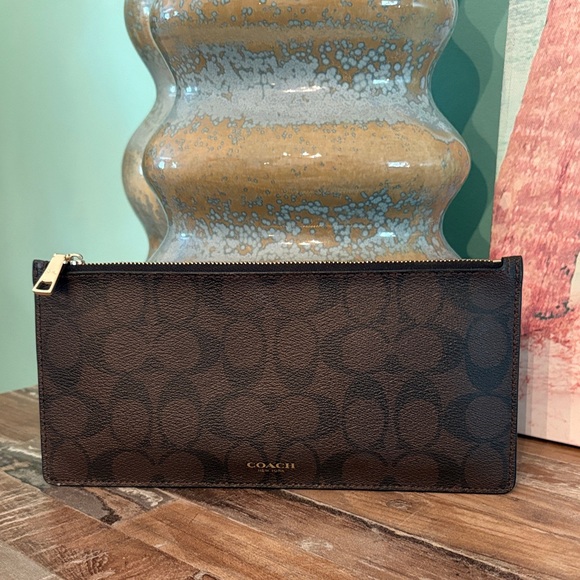 Coach Handbags - Coach Brown and Black Signature Zip clutch bag